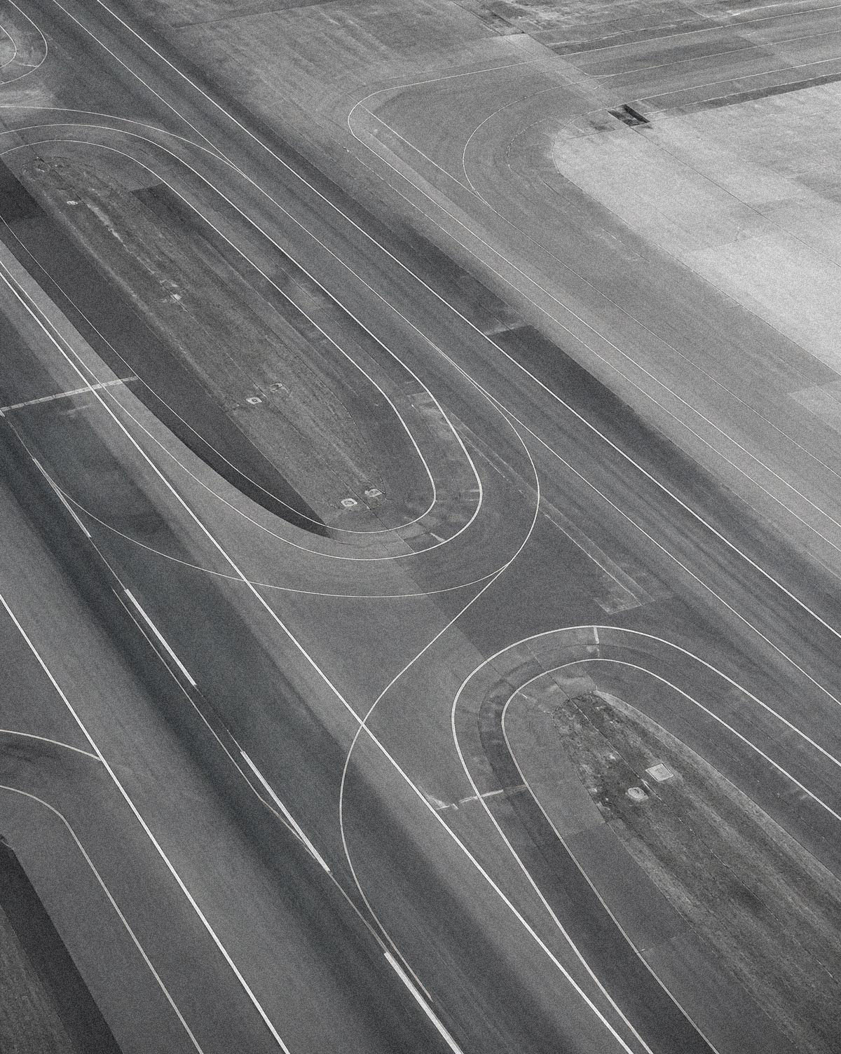 Aerial view of converging airport taxiways and runways