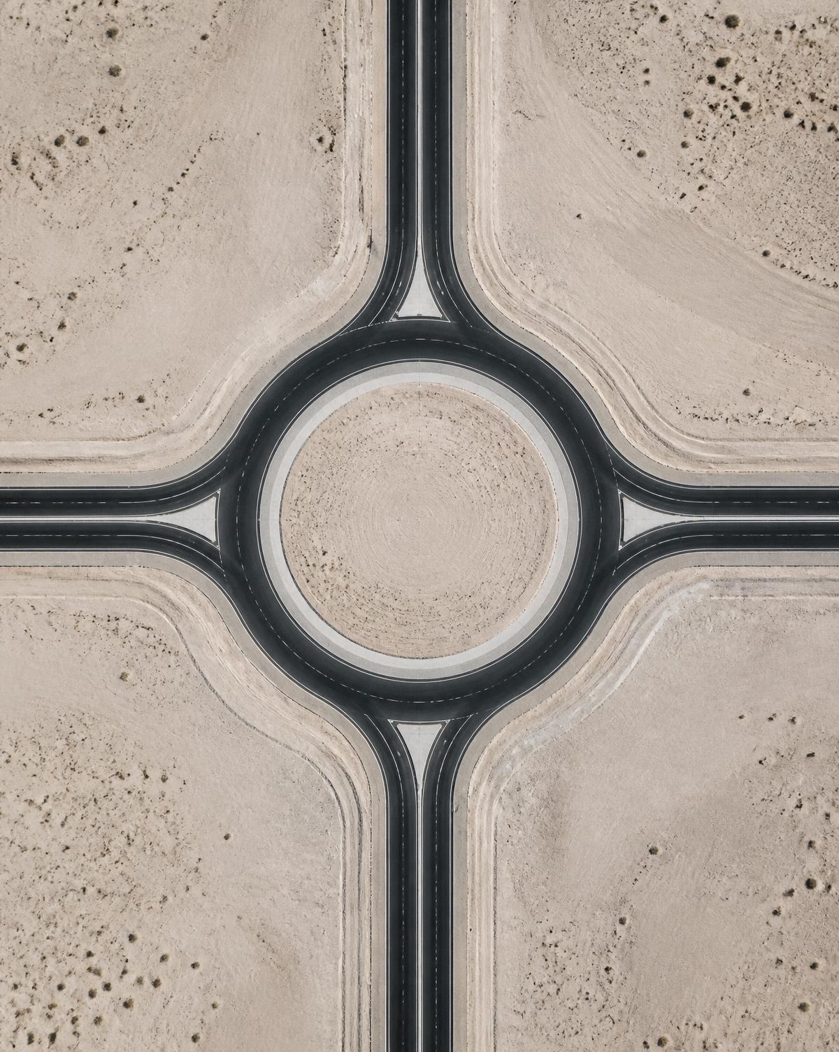 Overhead view of a desert junction with clean geometric lines