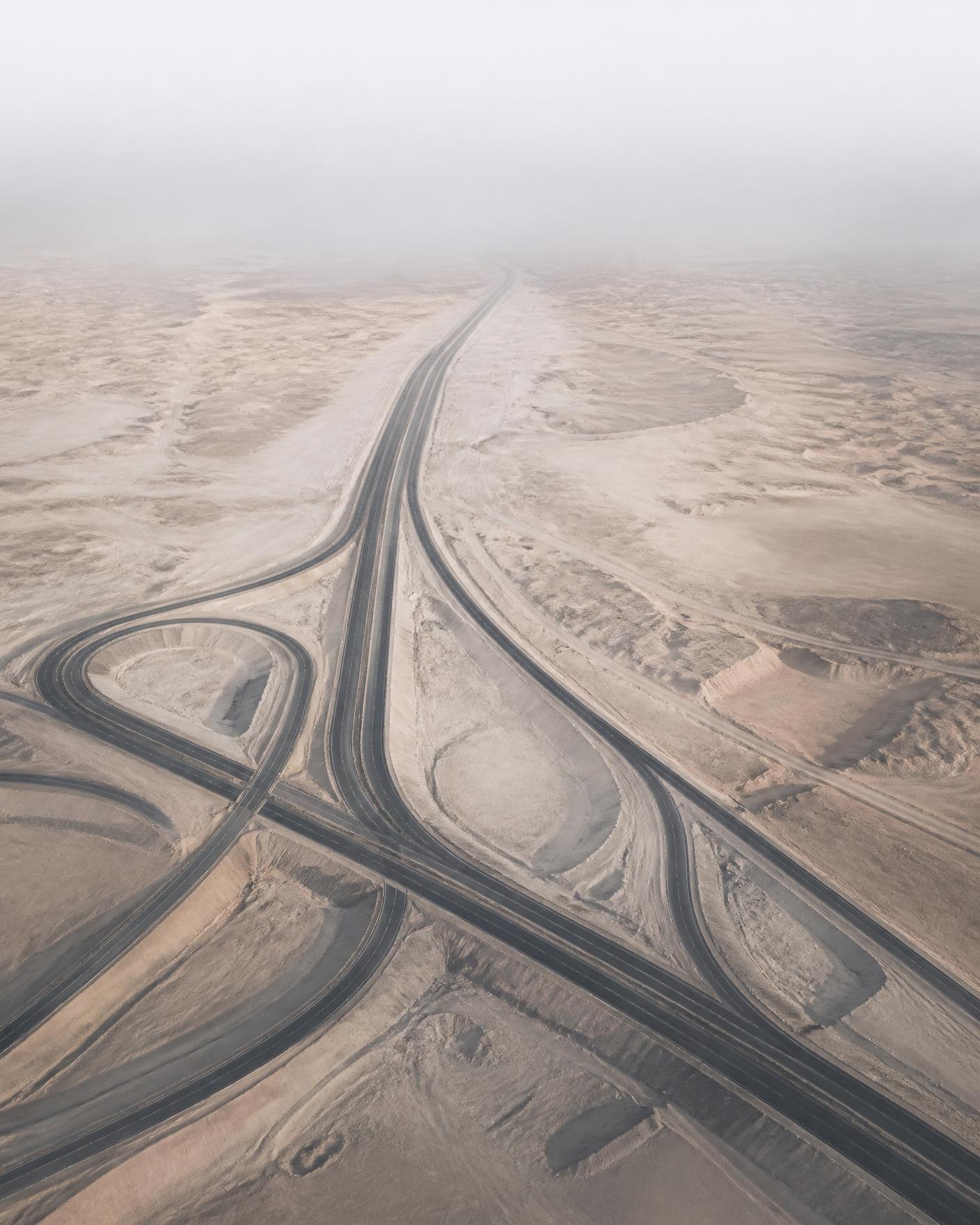 Desert interchange seen from above with converging routes
